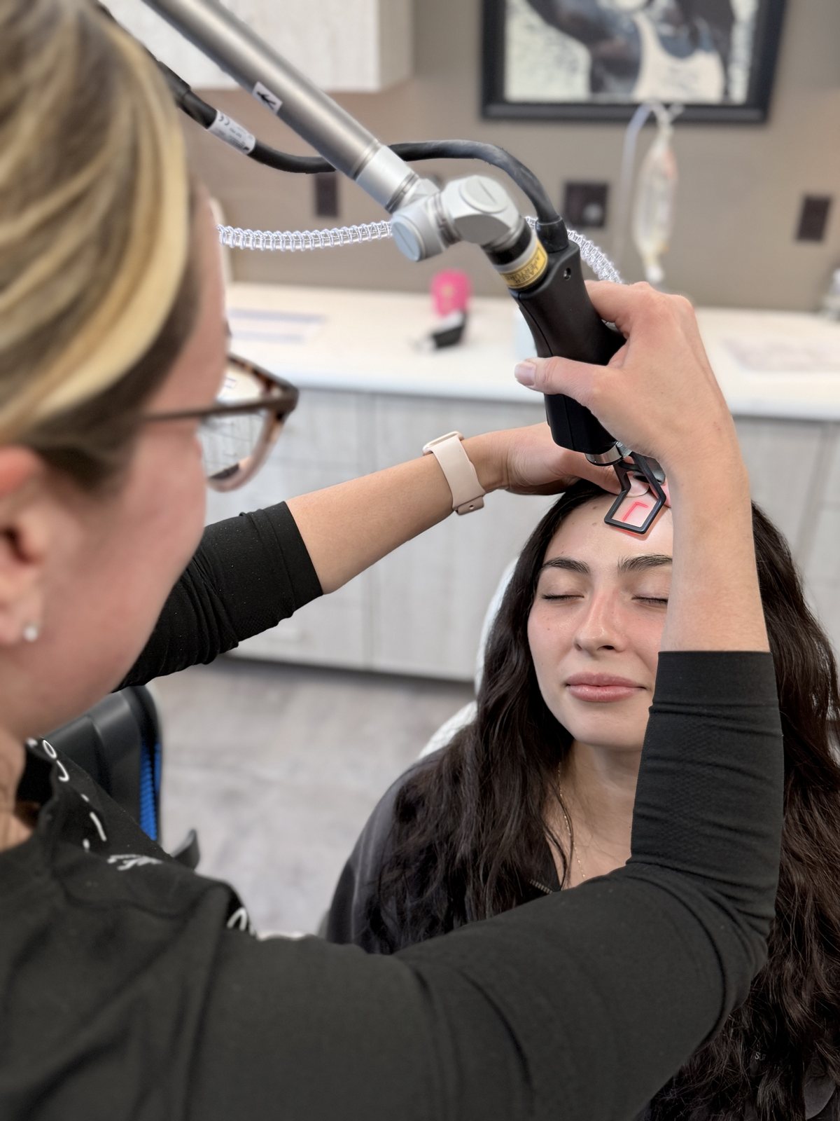 Close-up of a Tetra PRO CO2 laser treatment being performed at Refined